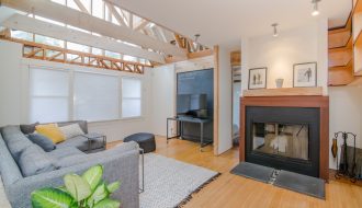 living room set with green dumb cane plant