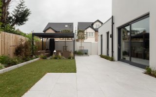 a house with a large yard and a covered patio