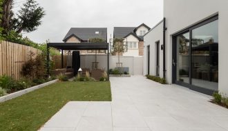 a house with a large yard and a covered patio