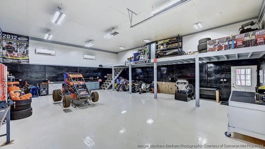 lake norman luxury home garage workshop with race car