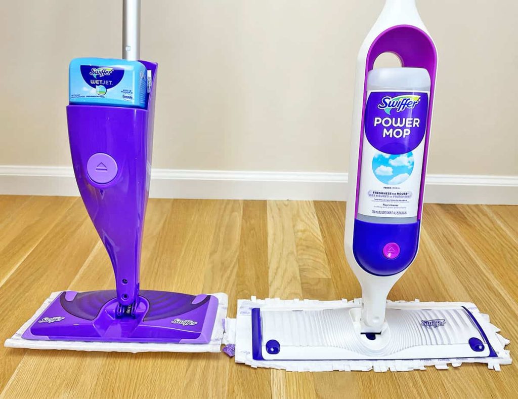 Swiffer WetJet and Swiffer Power Mop placed side by side on a hardwood floor for comparison.