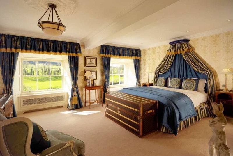 Elegant bedroom suite in Castlehyde House with ornate canopy bed and pastoral views