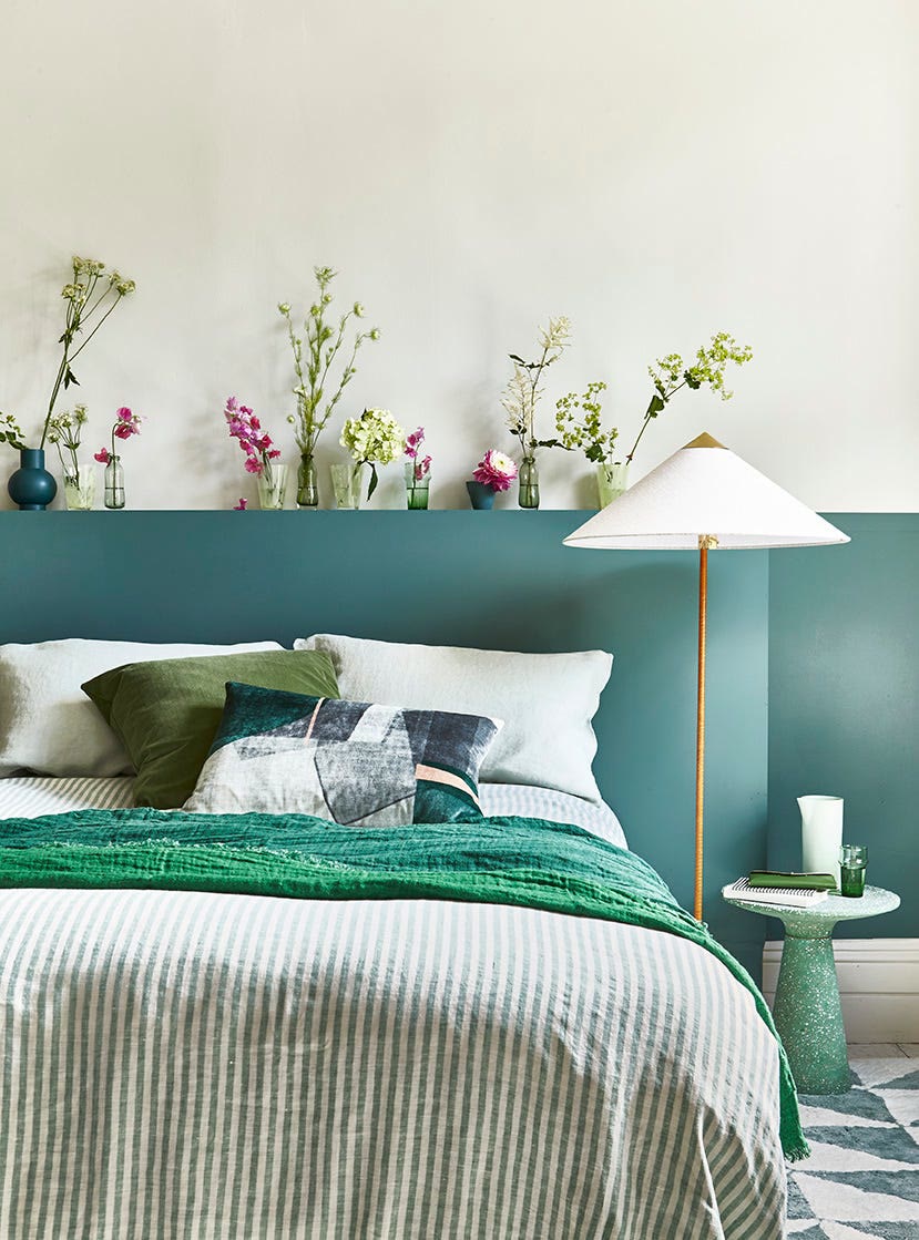 Forest green color-drenched bedroom with walls, ceiling, and trim all in deep green