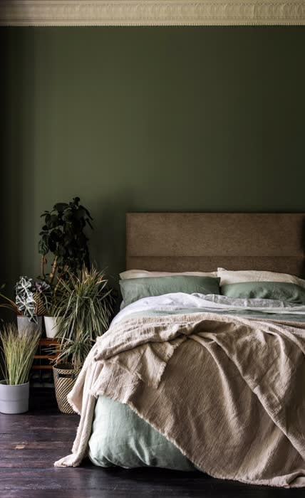 Mint green and white minimalist bedroom with clean lines and a bright airy feel