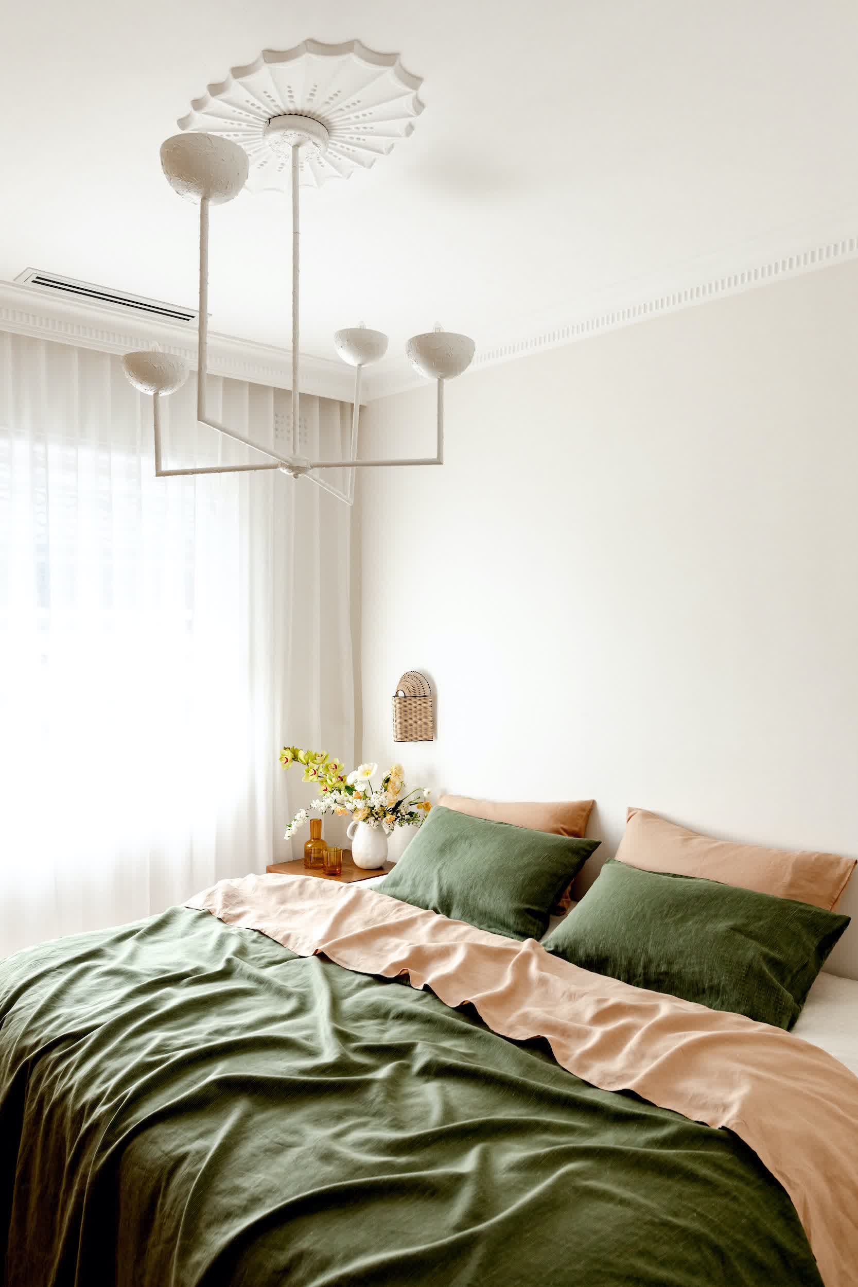 Pale green painted ceiling above white walls creating a subtle canopy of color