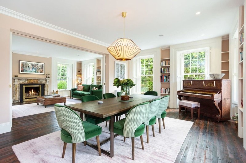 Saoirse Ronan open plan dining and living area with baby blue kitchen cabinets and marble island