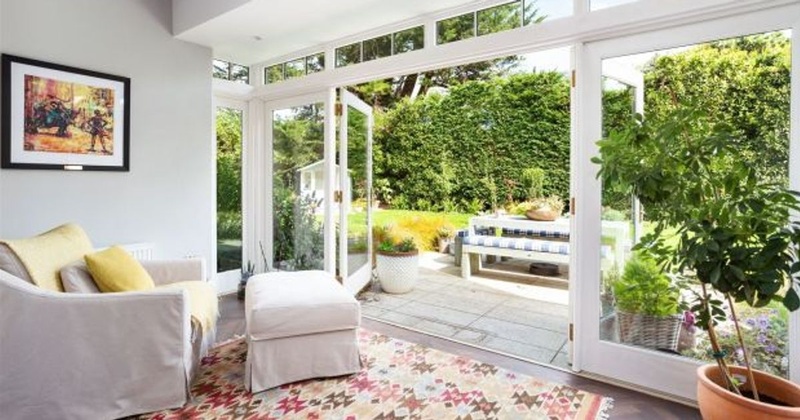 Saoirse Ronan sunroom conservatory with floor-to-ceiling glass doors at Pine Lodge Greystones